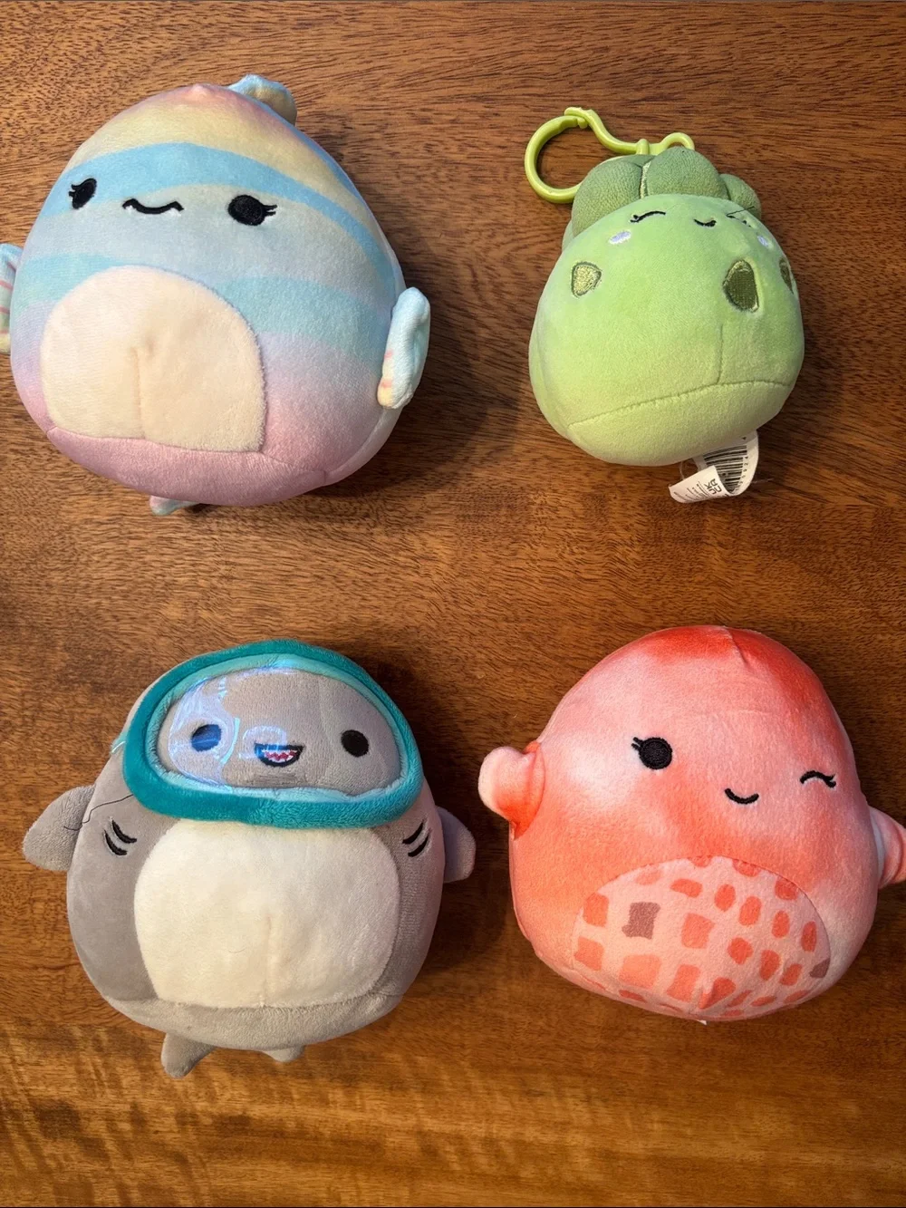 Squishmallows pastel rainbow, green, gray, and coral plush bundle